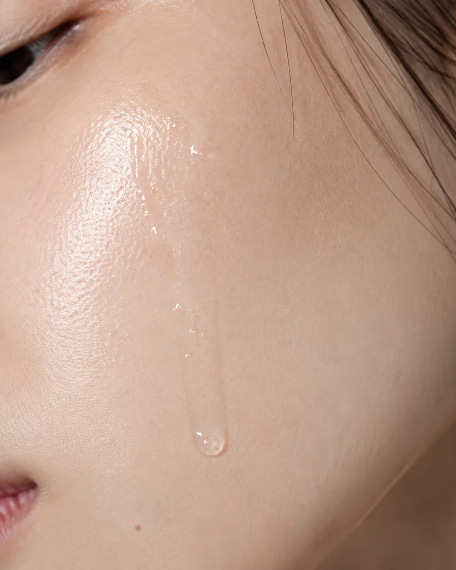 Serum on luminous skin, macro